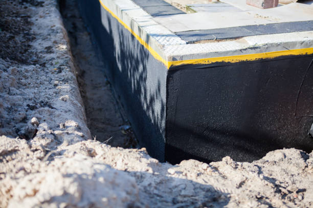 Professional Waterproofing technician working in Burket, IN
